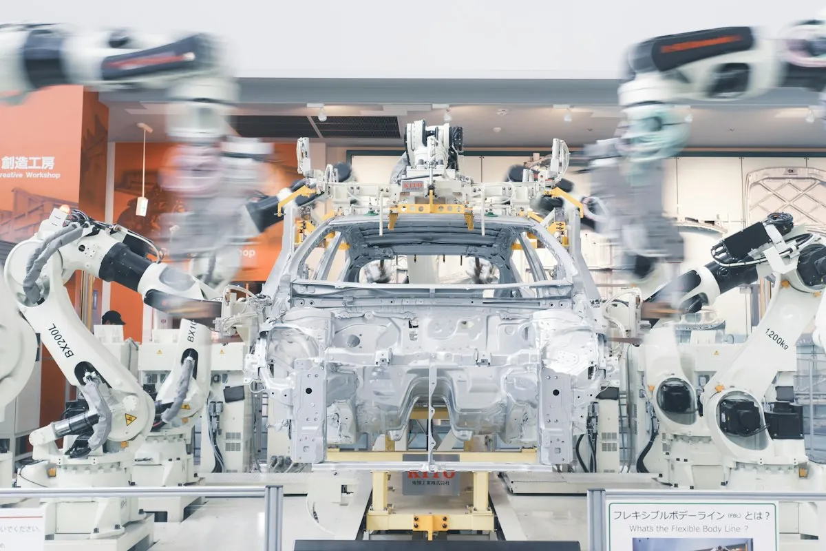 Robotic arms automating work on a production line